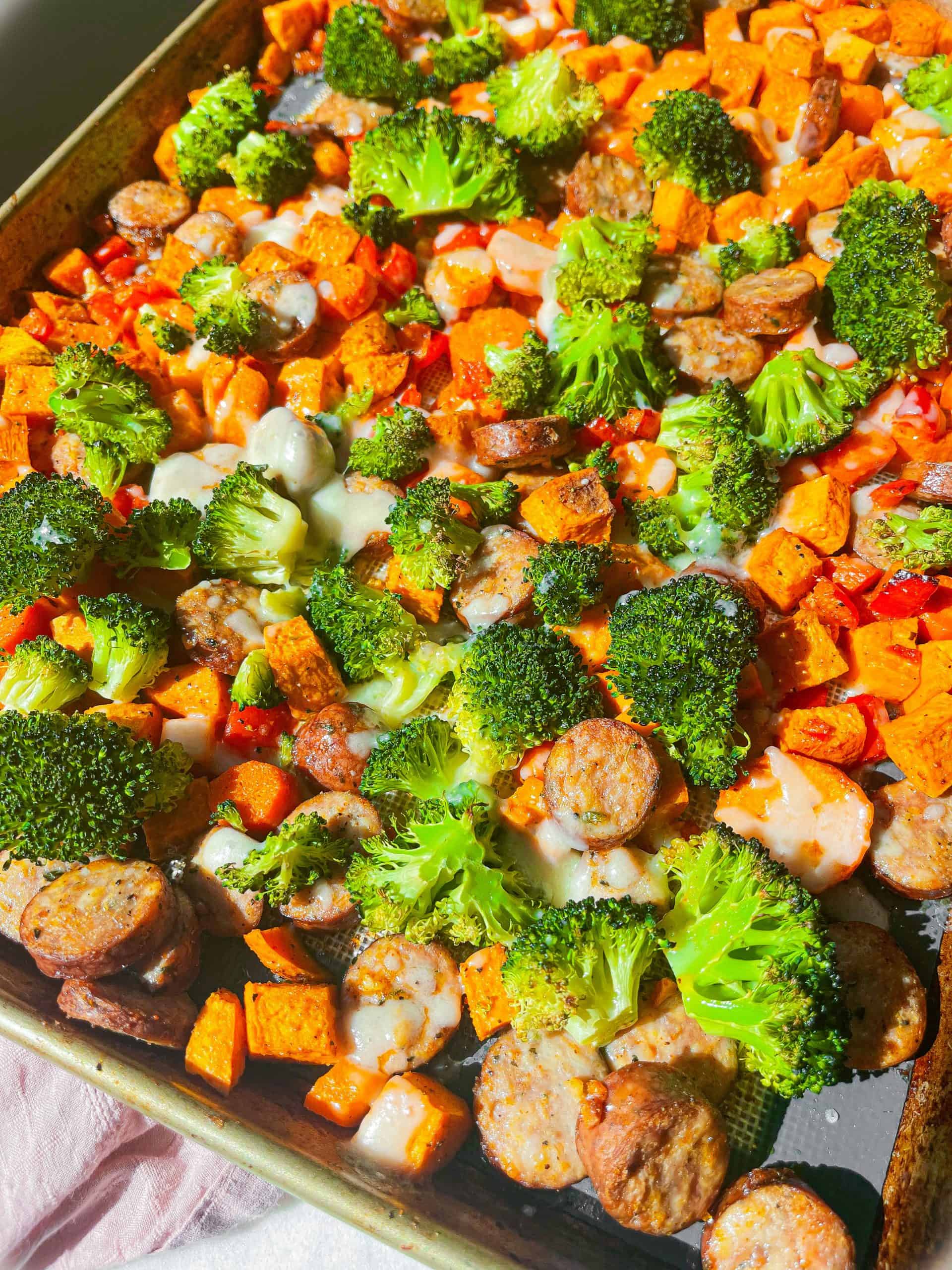 chicken sausage and veggies on a sheetpan