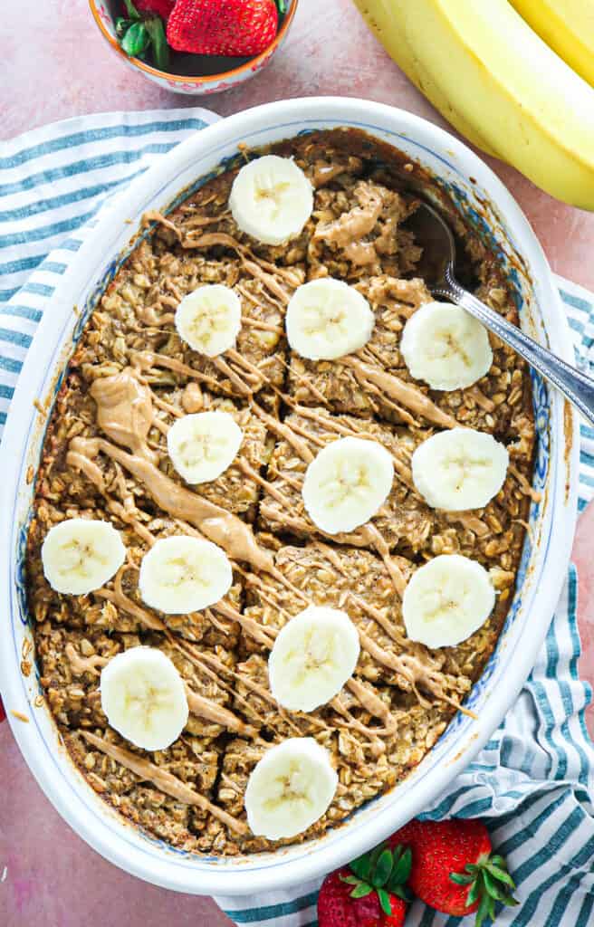 healthy banana baked oatmeal with peanut butter and sliced bananas