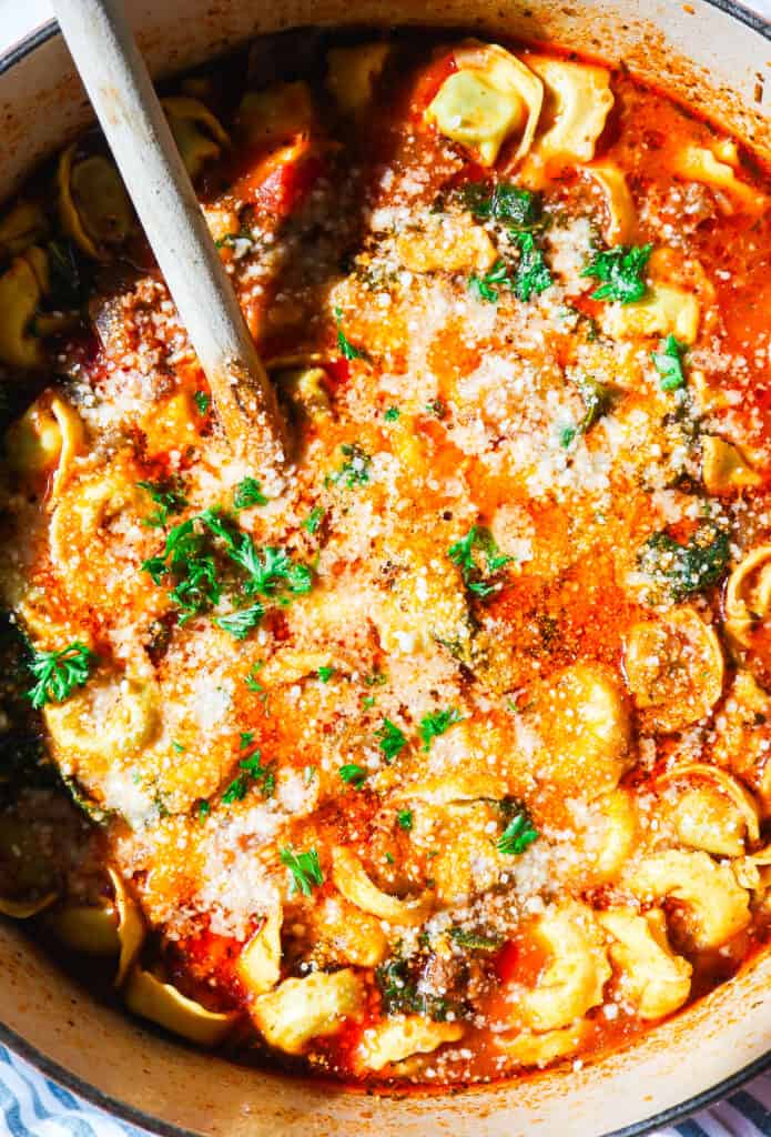 one pot tortellini lasagna soup with marinara, ricotta, parmesan in a large dutch oven 