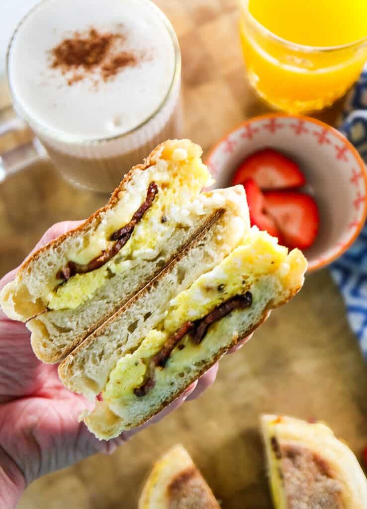 Starbucks copycat bacon gouda egg sandwiches with coffee, strawberries, and orange juice 