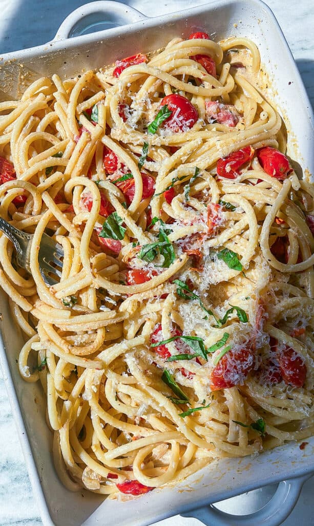 baked Boursin tomato pasta with bucatini and fresh basil and parmesan