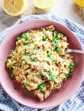 one pot sausage orzo with peas and parmesan with lemon zest and juice
