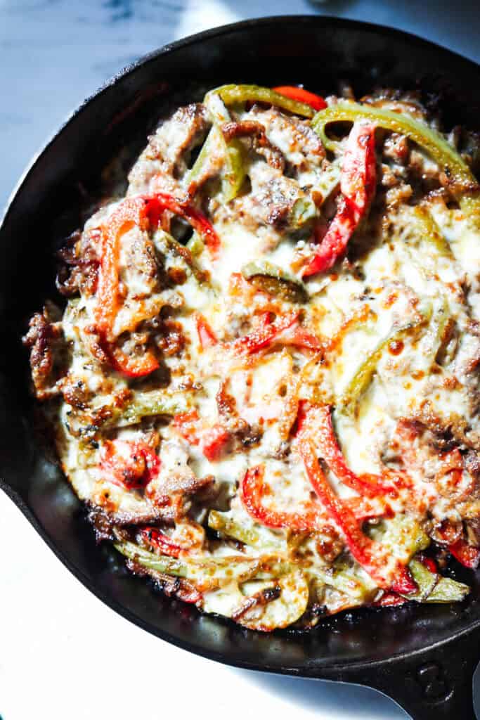 healthy Philly cheesesteak skillet with peppers onions and cheese