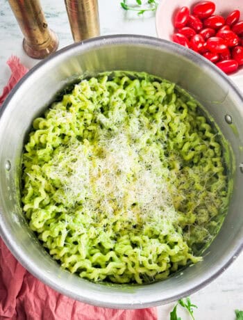 arugula basil pesto pasta with grated parmesan